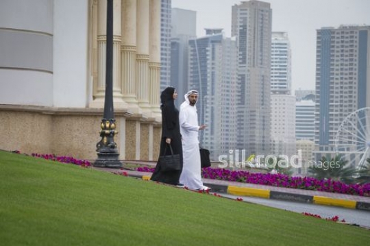 Arab Businessman and Businesswoman walking together |-