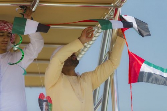 Arab man decorating the Yacht for the UAE National Day|