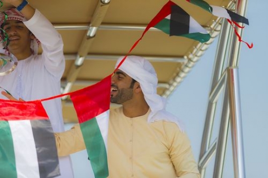 Arab man on the yacht preparing celebrations of the UAE National Day|