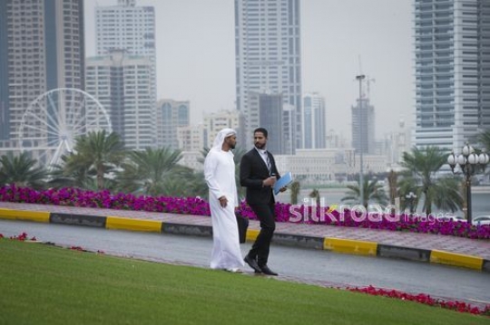 Arab Businessmen walking together|-