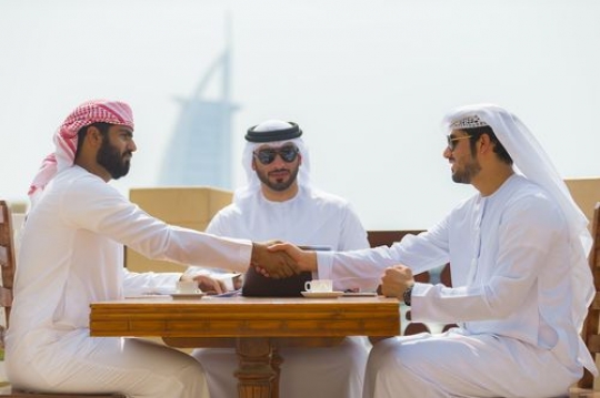 Business men during a client meeting|