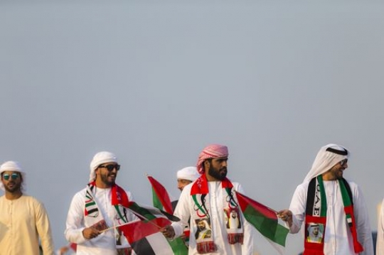 Middle eastern representing their country during a National Day Parade|-