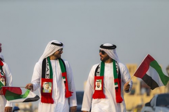 Middle eastern men representing their country during National Day|-