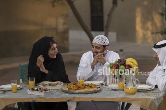 REPLACE - Middle Eastern family sitting together on the dinning table|-