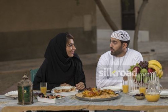 REPLACE - Arab man and woman talking to each other|-