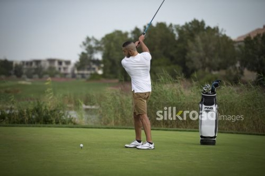 Young middle eastern man is playing golf|-