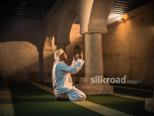 Old man praying at the mosque|-