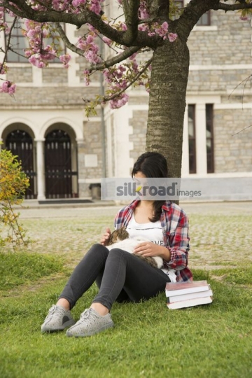 University Student sitting with the cat|