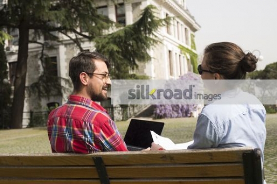 European Students sitting on campus studying|