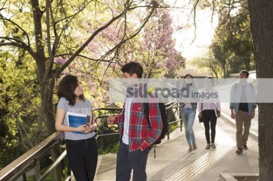 students talking to each other|