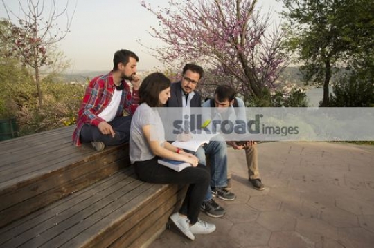 Students talking to the professor|