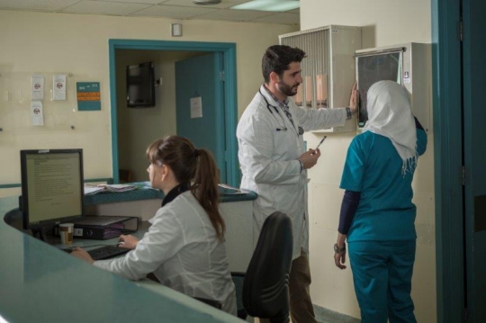 Doctor and Nurse Checking X-Ray Results