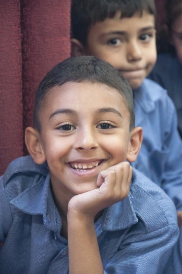 happiness schoolboy looking at camera