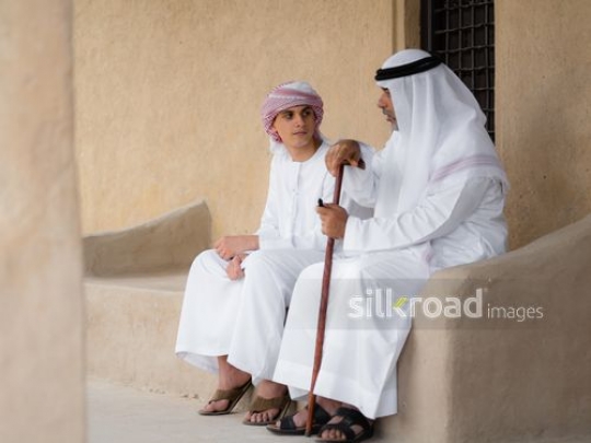 Boy listening to his grandfather|-