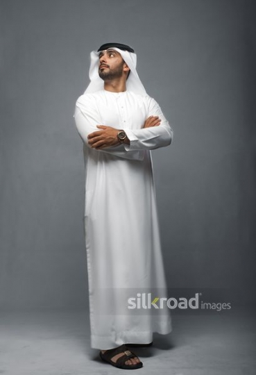 Middle Eastern Businessman looking up 