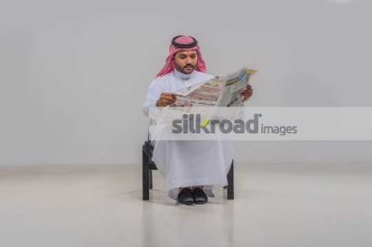 Businessman reading the newpaper