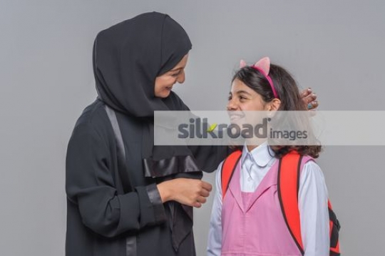 Mother taking to the little girl