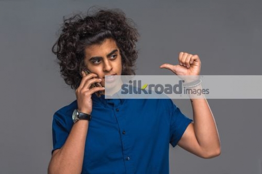 Middle Eastern teenager on the phone