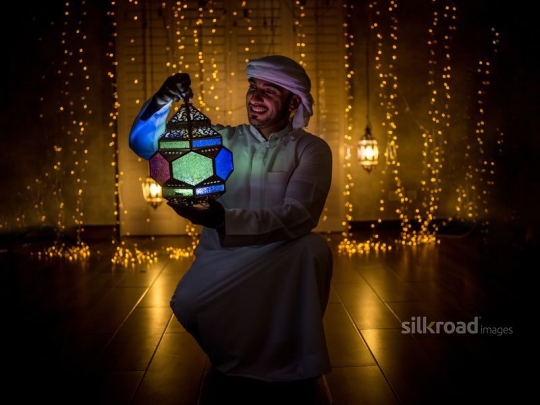 Man carrying lantern|-