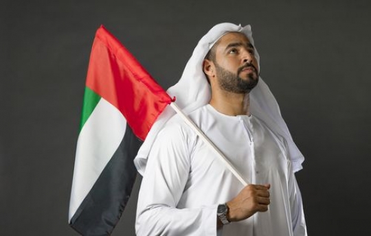 Middle Eastern man proudly celebrating his country