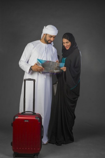 Middle Eastern couple traveling together|-