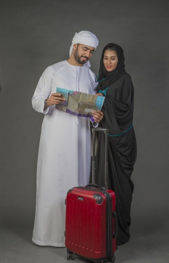 Middle Eastern couple traveling together|-