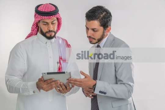Middle Eastern employees using the device|