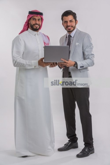 Businessmen standing with the laptop|