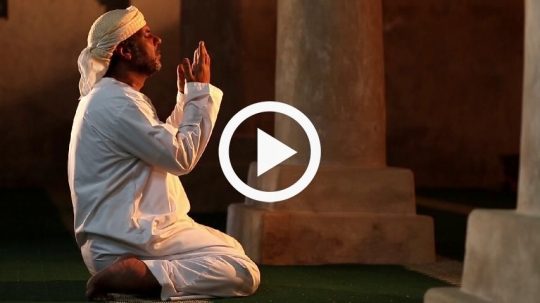 man praying at the mosque