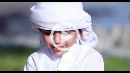 Arab boy celebrating the UAE National Day|