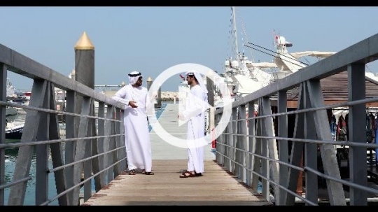 Two Arab men talking by the dock |