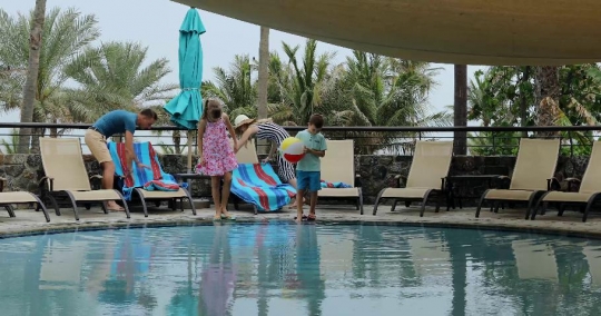 European Family together by the pool|-