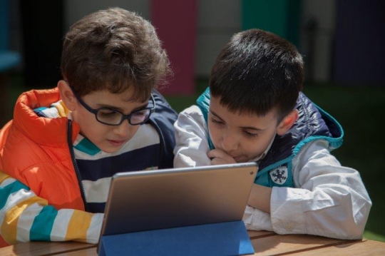 Boys Browsing Smart Tablet