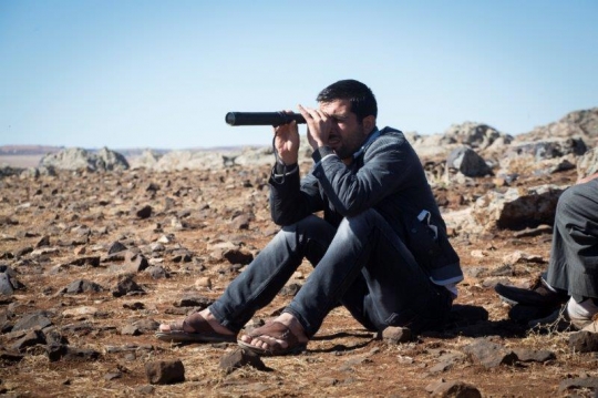 Syrian Refugee Man Looking at Home Syria from Kobane Camp