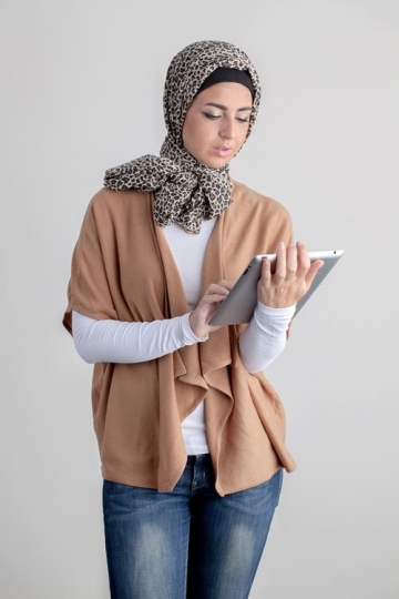 young woman holding ipad