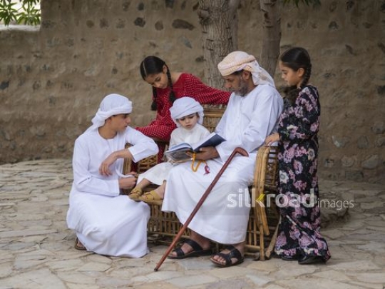 Kids reading qur'an with grandfather|-