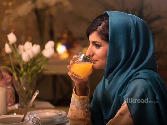 Woman drinking juice|-