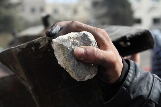 Hand Holding Rock