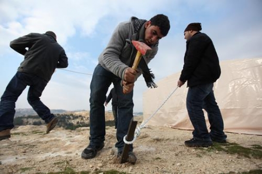 Men Building Tent near Bab al-Shams