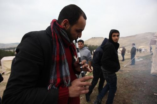 Palestinian demonstrators Playing flute at Bab al-Shams or Gate of the Sun 