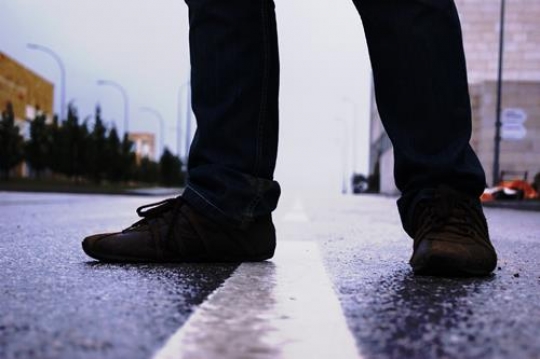 closeup of mans legs in jeans