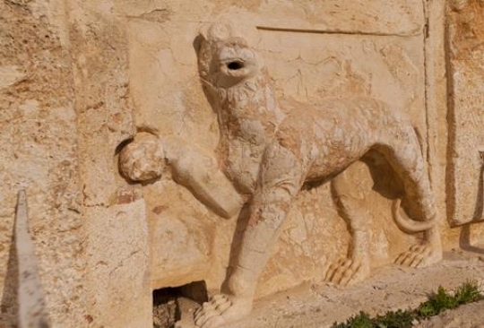 ancient symbol of a lion in stone