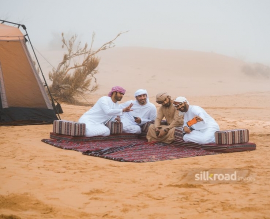 Man taking selfie with friends