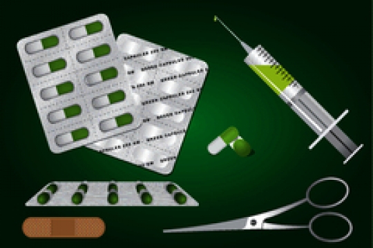 first aid kit on green background
