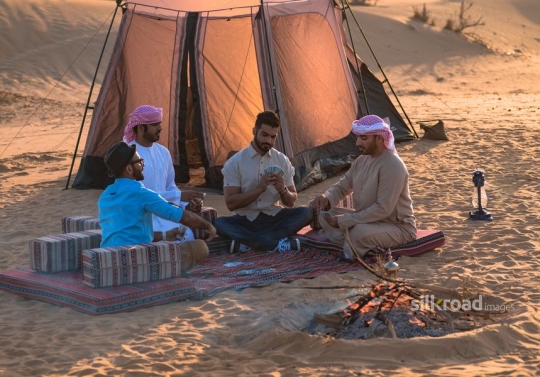 Group of friends playing cards