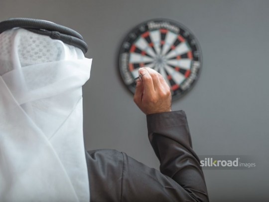 Arabian man aiming at the target