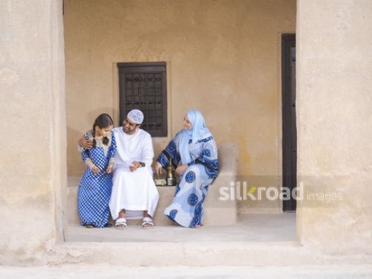 Girl joining parents outside|-