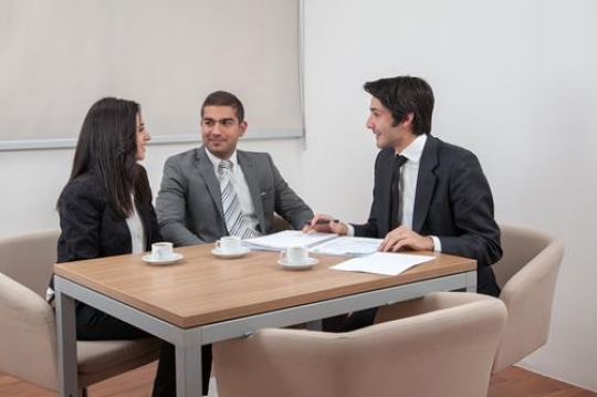 business people sitting at tab