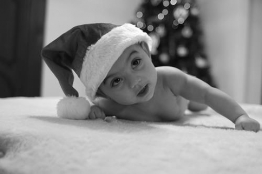 cute baby girl lying on her belly