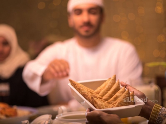 reaching for pastry|-